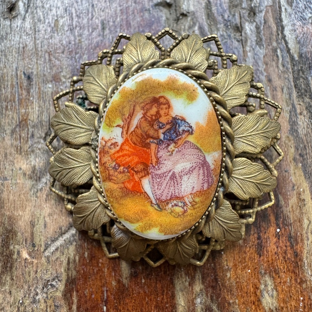 Vintage Gold Brooch with Romantic Scene